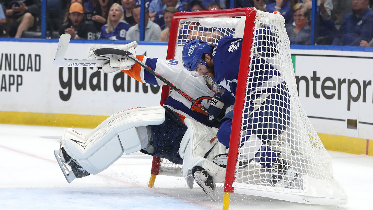 TAMPA, FLORIDA - JUNE 15: Brayden Point #21 of the Tampa Bay Lightning collides with Semyon Varlamov #40 of the New York Islanders in the net during the first period in Game Two of the Stanley Cup Semifinals in the 2021 Stanley Cup Playoffs at Amalie Arena on June 15, 2021 in Tampa, Florida.