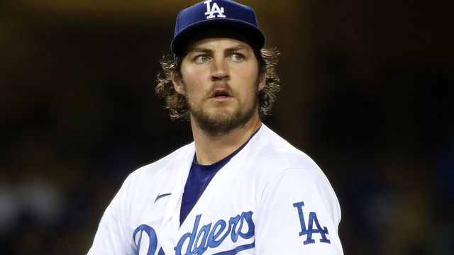 LOS ANGELES, CALIFORNIA - JUNE 12: Trevor Bauer #27 of the Los Angeles Dodgers looks on after giving up a hit to Joey Gallo #13 of the Texas Rangers during the fifth inning at Dodger Stadium on June 12, 2021 in Los Angeles, California.