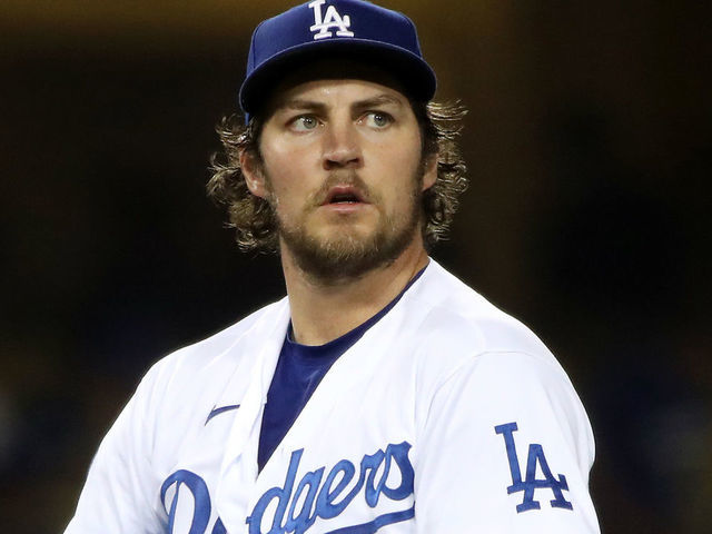 LOS ANGELES, CALIFORNIA - JUNE 12: Trevor Bauer #27 of the Los Angeles Dodgers looks on after giving up a hit to Joey Gallo #13 of the Texas Rangers during the fifth inning at Dodger Stadium on June 12, 2021 in Los Angeles, California.