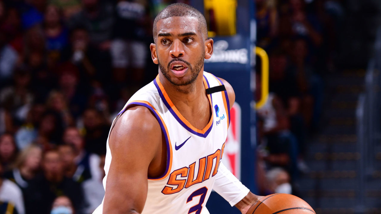 DENVER, CO - JUNE 13: Chris Paul #3 of the Phoenix Suns dribbles the ball during Round 2, Game 4 of the 2021 NBA Playoffs on June 13, 2021 at the Ball Arena in Denver, Colorado. NOTE TO USER: User expressly acknowledges and agrees that, by downloading and/or using this Photograph, user is consenting to the terms and conditions of the Getty Images License Agreement. Mandatory Copyright Notice: Copyright 2021 NBAE
