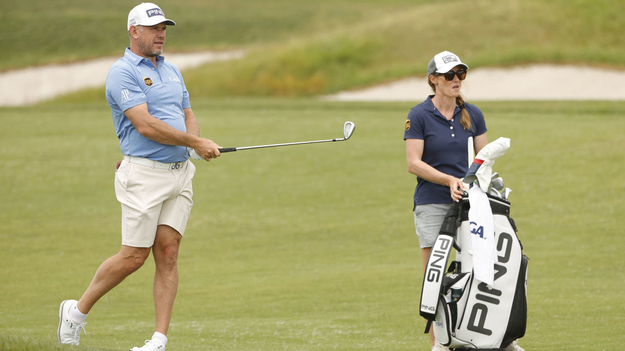 SAN DIEGO, CALIFORNIA - JUNE 14: Lee Westwood of England plays a shot on the fifth hole as caddie Helen Storey looks on during a practice round prior to the start of the 2021 U.S. Open at Torrey Pines Golf Course on June 14, 2021 in San Diego, California.
