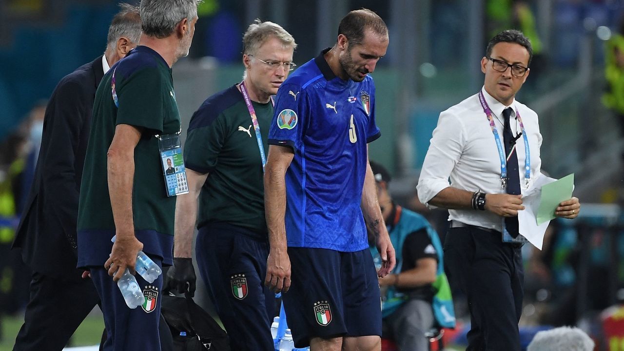 Italy's defender Giorgio Chiellini leaves the pitch following an injury during the UEFA EURO 2020 Group A football match between Italy and Switzerland at the Olympic Stadium in Rome on June 16, 2021.