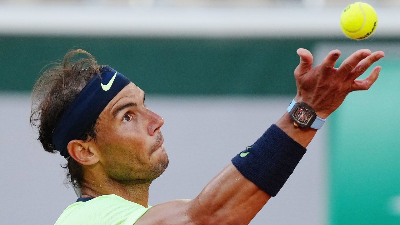 Rafael Nadal of Spain serves during the men's singles semifinal against Novak Djokovic of Serbia at the French Open tennis tournament at Roland Garros in Paris, France, June 11, 2021.
