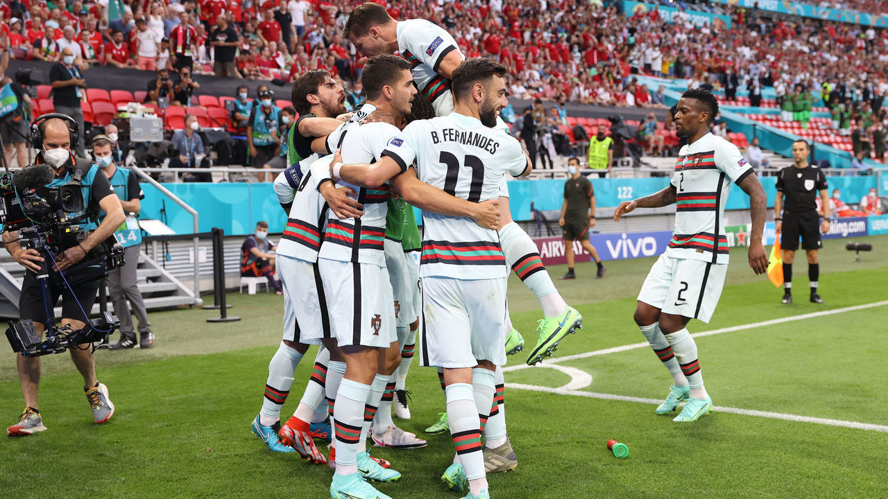BUDAPEST, HUNGARY - JUNE 15: Cristiano Ronaldo of Portugal celebrates with Bruno Fernandes and team mates after scoring their side's second goal during the UEFA Euro 2020 Championship Group F match between Hungary and Portugal at Puskas Arena on June 15, 2021 in Budapest, Hungary.