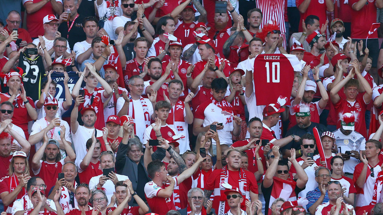 COPENHAGEN, DENMARK - JUNE 17: Denmark fans applaud as the ball is kicked out of play in the tenth minute followed by a minute of applause in support of Denmark International Christian Eriksen, who experienced a cardiac arrest during the match against Finland during the UEFA Euro 2020 Championship Group B match between Denmark and Belgium at Parken Stadium on June 17, 2021 in Copenhagen, Denmark.