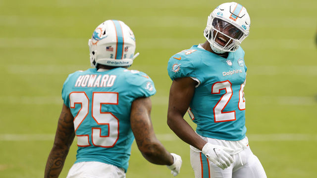 MIAMI GARDENS, FLORIDA - DECEMBER 06: Cornerbacks Byron Jones #24 and Xavien Howard #25 of the Miami Dolphins celebrate after a defensive play in the second quarter of the game against the Cincinnati Bengals at Hard Rock Stadium on December 06, 2020 in Miami Gardens, Florida.