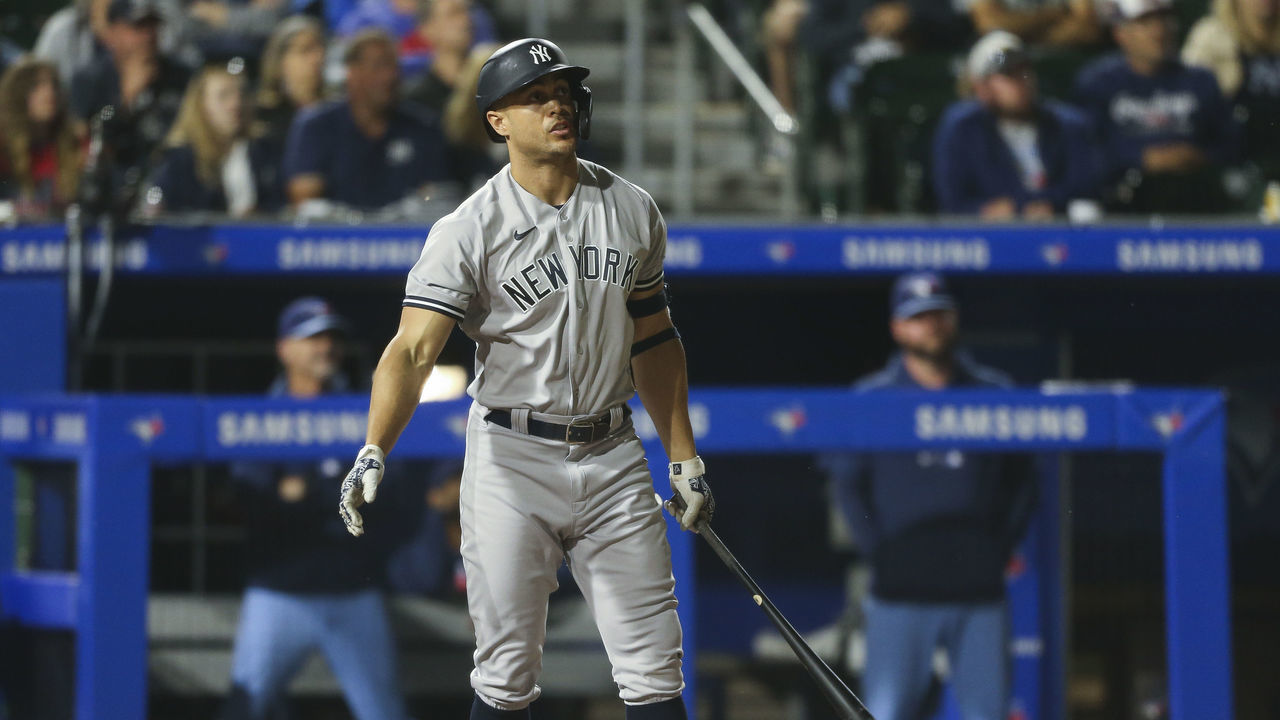 BUFFALO, NEW YORK - JUNE 17: Giancarlo Stanton #27 of the New York Yankees watches his two-run home run fly over the wall during the seventh inning against the Toronto Blue Jays at Sahlen Field on June 17, 2021 in Buffalo, New York.