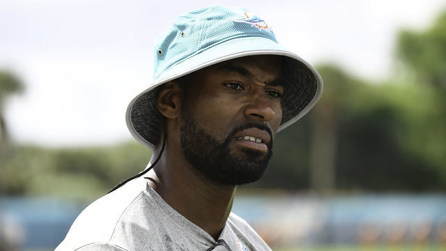 DAVIE, FL - AUGUST 08: Former Detroit Lions wide receiver Calvin Johnson looks on at Miami Dolphins training camp on August 8, 2017 at the Miami Dolphins training facility in Davie, Florida.