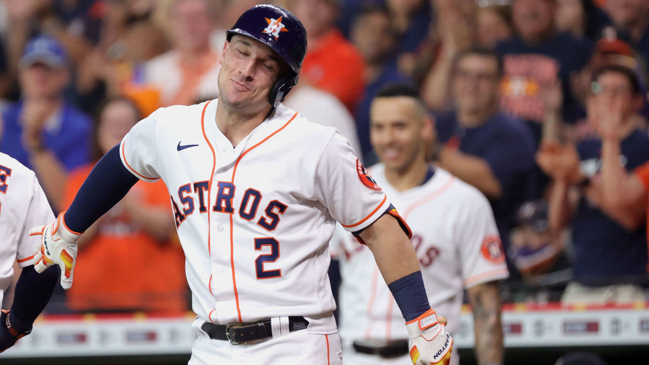 HOUSTON, TEXAS - JUNE 16: Alex Bregman #2 of the Houston Astros reacts to Jose Altuve #27 hitting a home run during the first inning against the Texas Rangers at Minute Maid Park on June 16, 2021 in Houston, Texas.