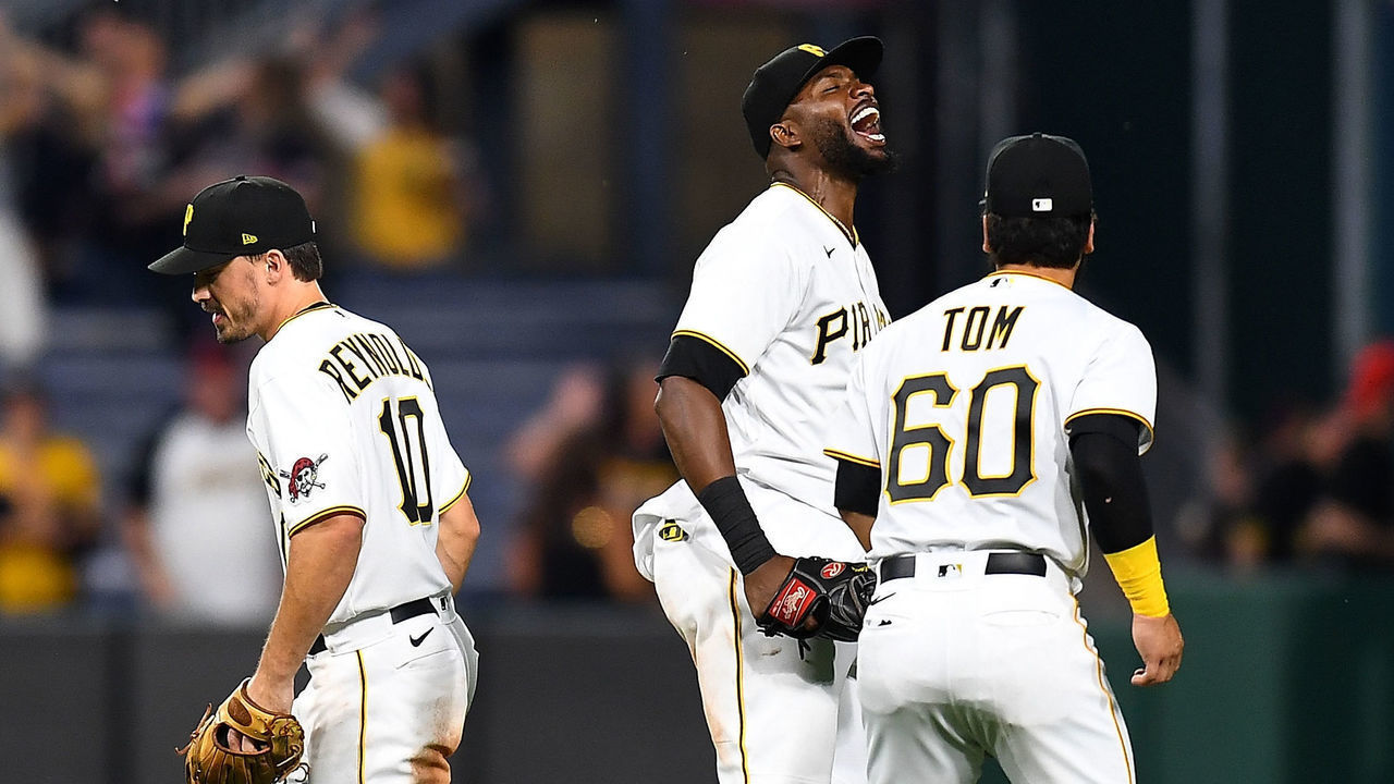 PITTSBURGH, PA - JUNE 18: Gregory Polanco #25 celebrates with Ka'ai Tom #60 of the Pittsburgh Pirates after a 11-10 win over the Cleveland Indians at PNC Park on June 18, 2021 in Pittsburgh, Pennsylvania.
