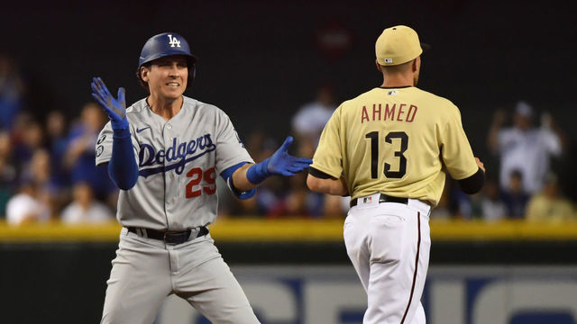 PHOENIX, ARIZONA - JUNE 18: Andy Burns #29 of the Los Angeles Dodgers celebrates after hitting a double against the Arizona Diamondbacks during the eighth inning at Chase Field on June 18, 2021 in Phoenix, Arizona.