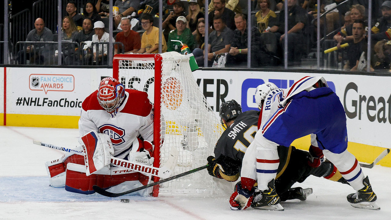 LAS VEGAS, NEVADA - JUNE 14: Carey Price #31 of the Montreal Canadiens makes a save against Reilly Smith #19 of the Vegas Golden Knights as Alexander Romanov #27 of the Canadiens defends during the second period in Game One of the Stanley Cup Semifinals during the 2021 Stanley Cup Playoffs at T-Mobile Arena on June 14, 2021 in Las Vegas, Nevada.