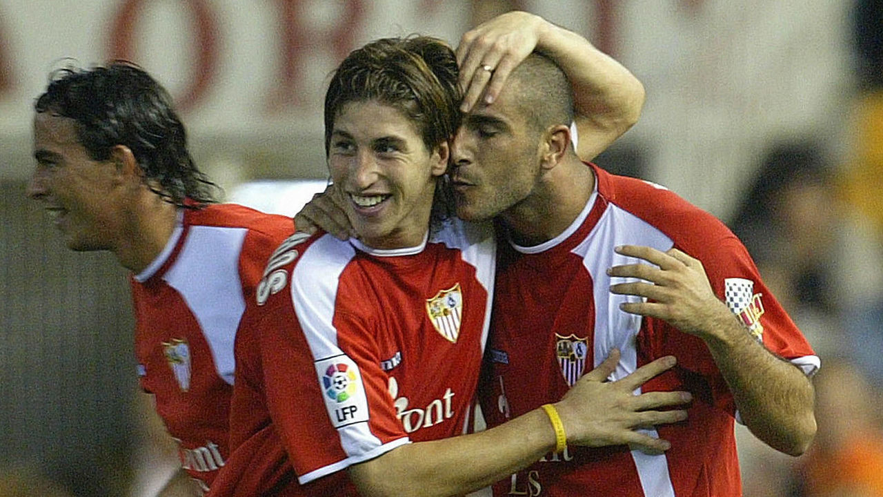 VALENCIA, SPAIN: Sevilla's Carlos Aranda (R) celebrates his goal with teanmate Sergio Ramos (C) and Jordi Lopez (L) during their Spanish League match at Mestalla stadium of Valencia 17 October 2004. Sevilla won 2-1. AFP PHOTO/ JOSE JORDAN