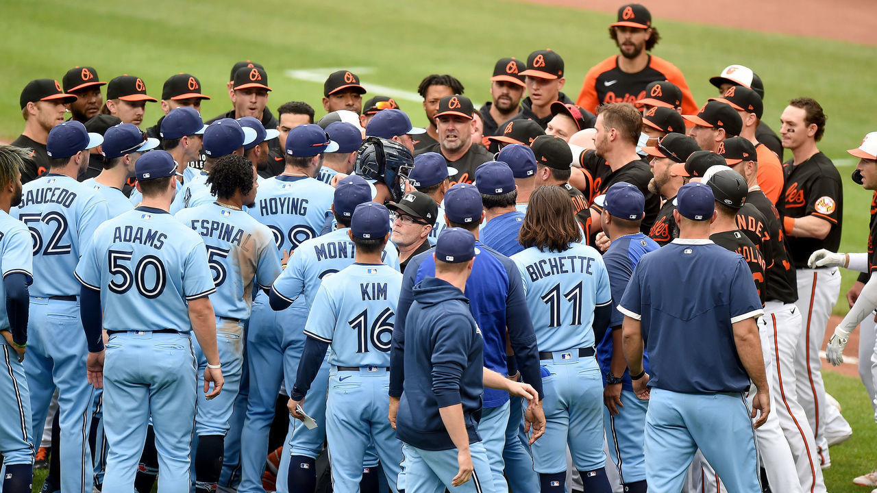 BALTIMORE, MARYLAND - JUNE 19: The Baltimore Orioles and Toronto Blue Jays dugouts empty onto the field after Maikel Franco #3 of the Baltimore Orioles was hit by a pitch in the fourth inning at Oriole Park at Camden Yards on June 19, 2021 in Baltimore, Maryland.