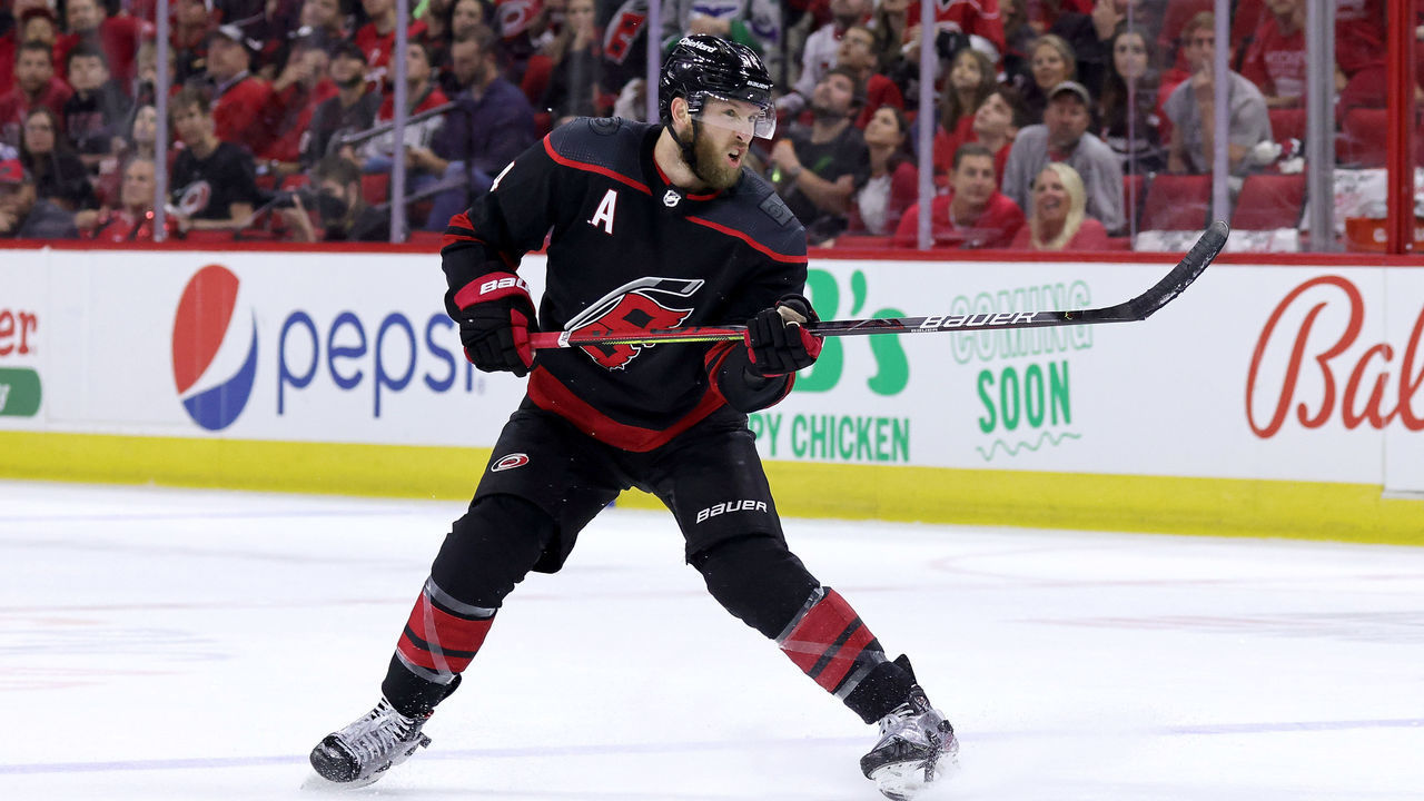 RALEIGH, NC - JUNE 8: Jaccob Slavin #74 of the Carolina Hurricanes shoots the puck in Game Five of the Second Round of the 2021 Stanley Cup Playoffs against the Tampa Bay Lightning on June 8, 2021 at PNC Arena in Raleigh, North Carolina.