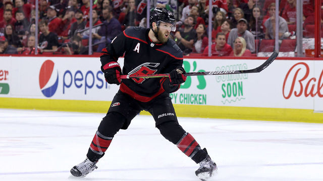 RALEIGH, NC - JUNE 8: Jaccob Slavin #74 of the Carolina Hurricanes shoots the puck in Game Five of the Second Round of the 2021 Stanley Cup Playoffs against the Tampa Bay Lightning on June 8, 2021 at PNC Arena in Raleigh, North Carolina.