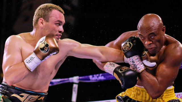 GUADALAJARA, MEXICO - JUNE 19: Julio Cesar Chavez Jr (L) throws a punch at Anderson "Spider" Silva (R) during a fight as part of the Tribute to the Kings at Jalisco Stadium on June 19, 2021 in Guadalajara, Mexico.