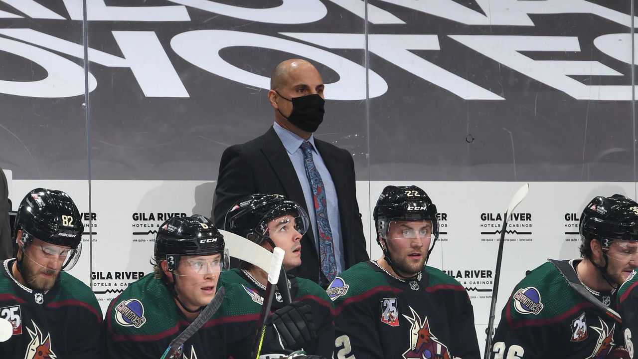GLENDALE, ARIZONA - JANUARY 14: Head coach Rick Tocchet of the Arizona Coyotes looks on from the bench during a game against the San Jose Sharks at Gila River Arena on January 14, 2021 in Glendale, Arizona.