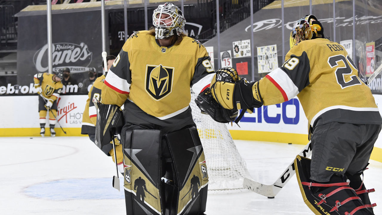 LAS VEGAS, NEVADA - MARCH 22: Robin Lehner #90 and Marc-Andre Fleury #29 of the Vegas Golden Knights warm up prior to a game against the St. Louis Blues at T-Mobile Arena on March 22, 2021 in Las Vegas, Nevada.
