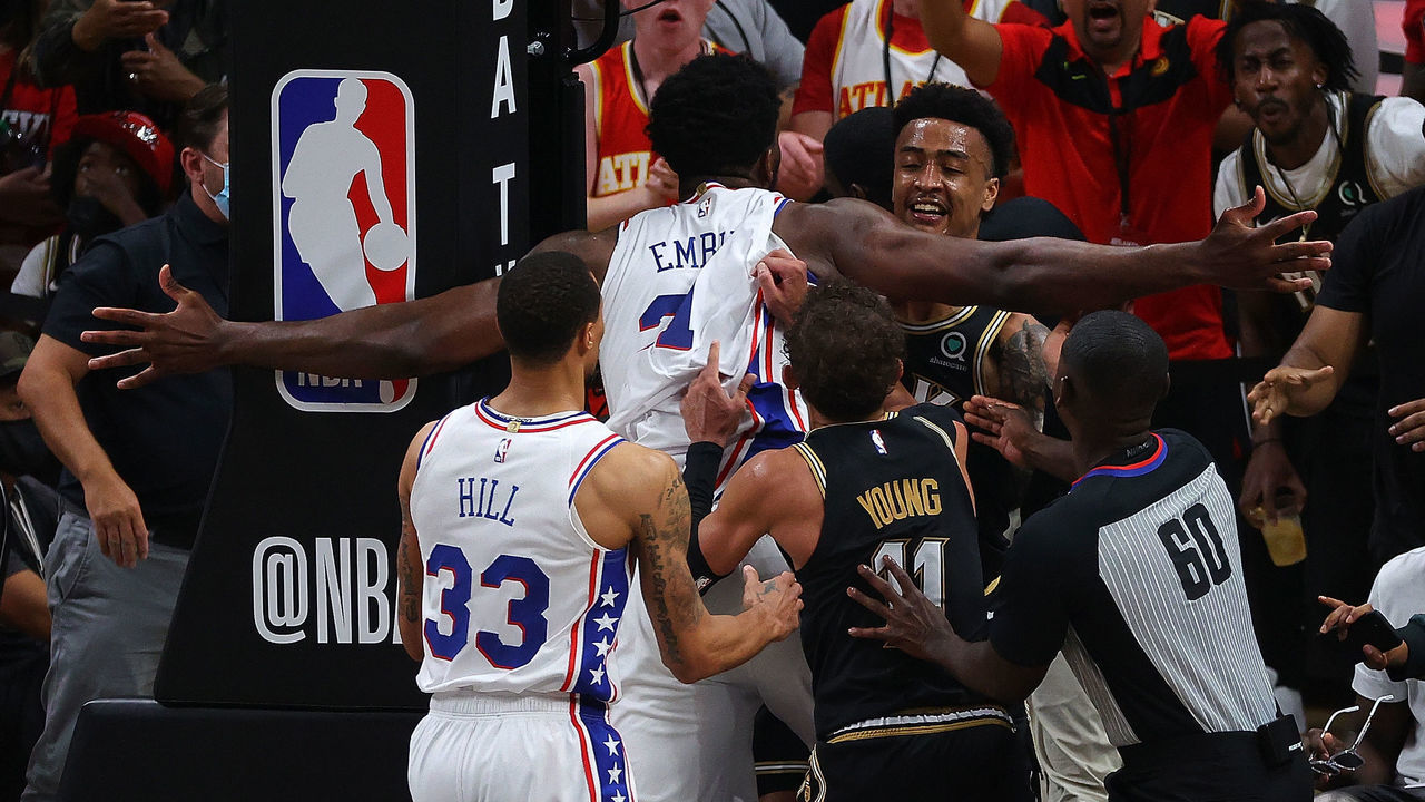 ATLANTA, GEORGIA - JUNE 18: Joel Embiid #21 of the Philadelphia 76ers and John Collins #20 of the Atlanta Hawks have an altercation after an offensive foul by Embiid during the second half of game 6 of the Eastern Conference Semifinals at State Farm Arena on June 18, 2021 in Atlanta, Georgia. Embiid and Collins were both given technical fouls after a review.