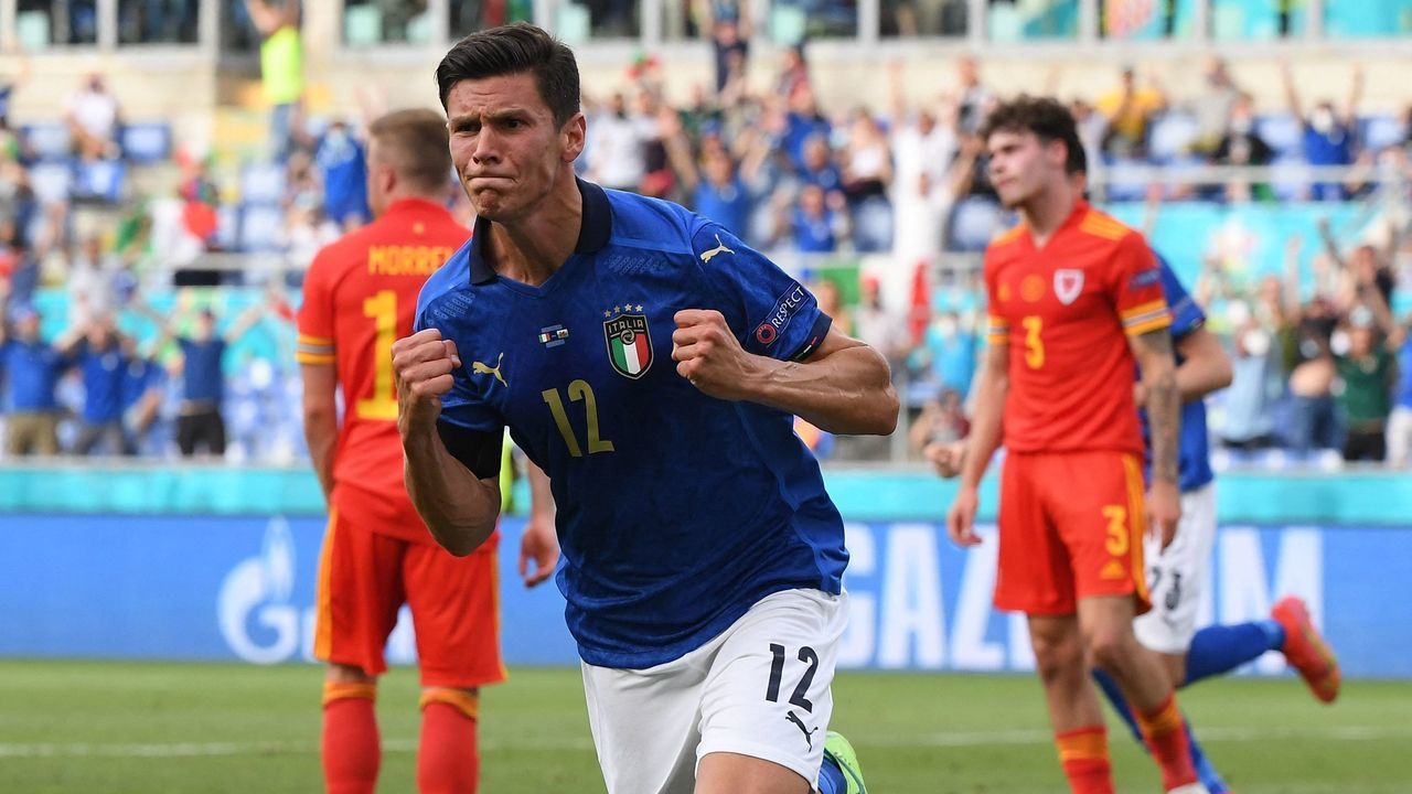 TOPSHOT - Italy's midfielder Matteo Pessina runs to celebrate the opening goal during the UEFA EURO 2020 Group A football match between Italy and Wales at the Olympic Stadium in Rome on June 20, 2021.