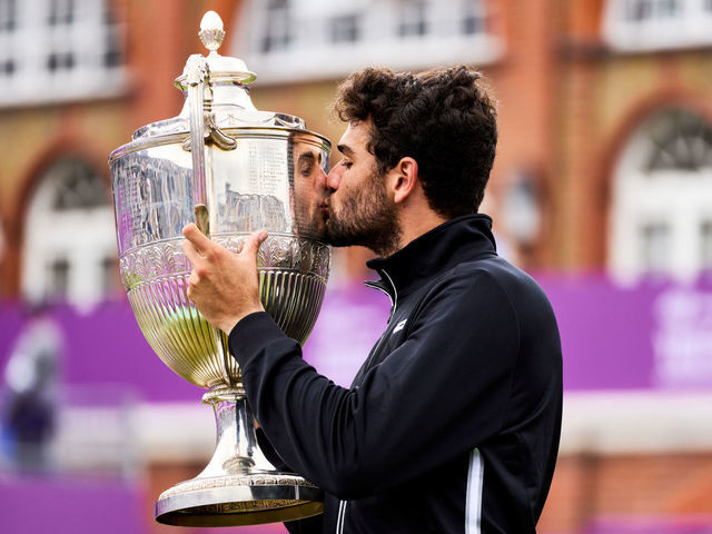 Italy's Matteo Berrettini kisses the trophy after winning the cinch Championships at The Queen's Club, London. Picture date: Sunday June 20, 2021.
