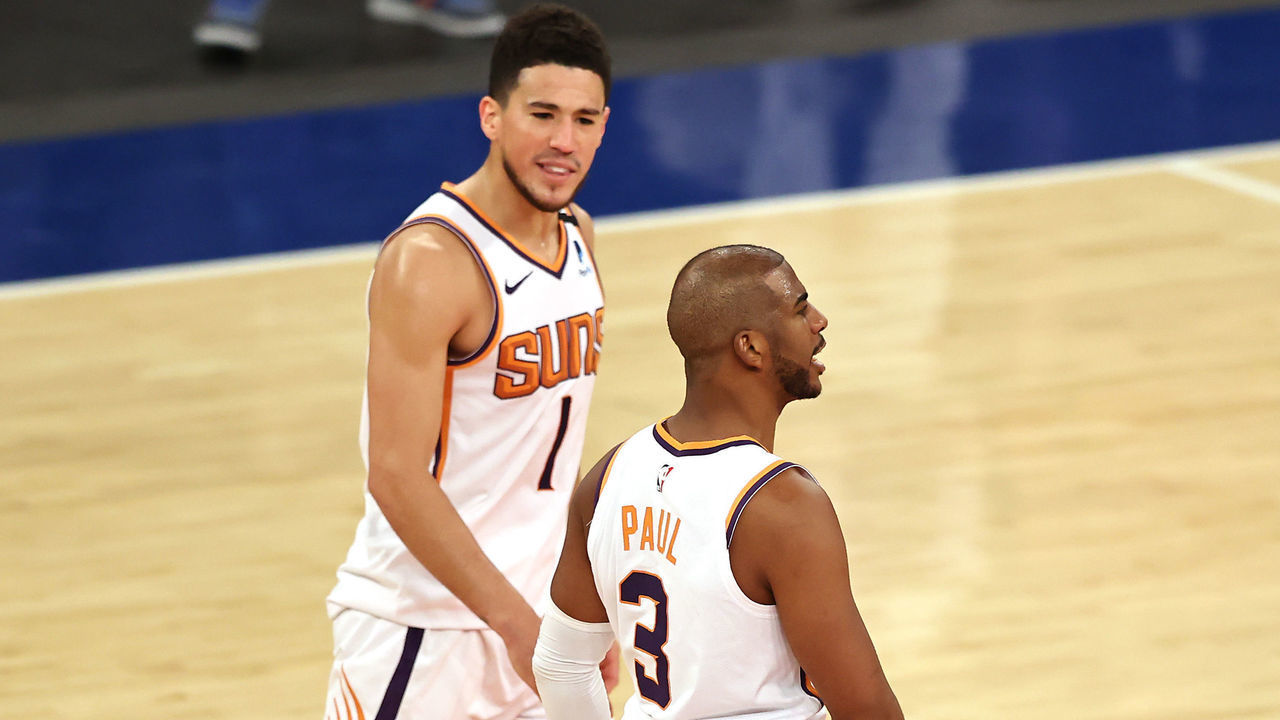 NEW YORK, NEW YORK - APRIL 26: Chris Paul #3 of the Phoenix Suns celebrates his three point shot with teammate Devin Booker #1 in the fourth quarter against the New York Knicks at Madison Square Garden on April 26, 2021 in New York City.