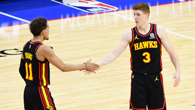 PHILADELPHIA, PA - JUNE 20: Trae Young #11 of the Atlanta Hawks high fives Kevin Huerter #3 of the Atlanta Hawks during Round 2, Game 7 of the 2021 NBA Playoffs on June 20, 2021 at Wells Fargo Center in Philadelphia, Pennsylvania. NOTE TO USER: User expressly acknowledges and agrees that, by downloading and/or using this Photograph, user is consenting to the terms and conditions of the Getty Images License Agreement. Mandatory Copyright Notice: Copyright 2021 NBAE