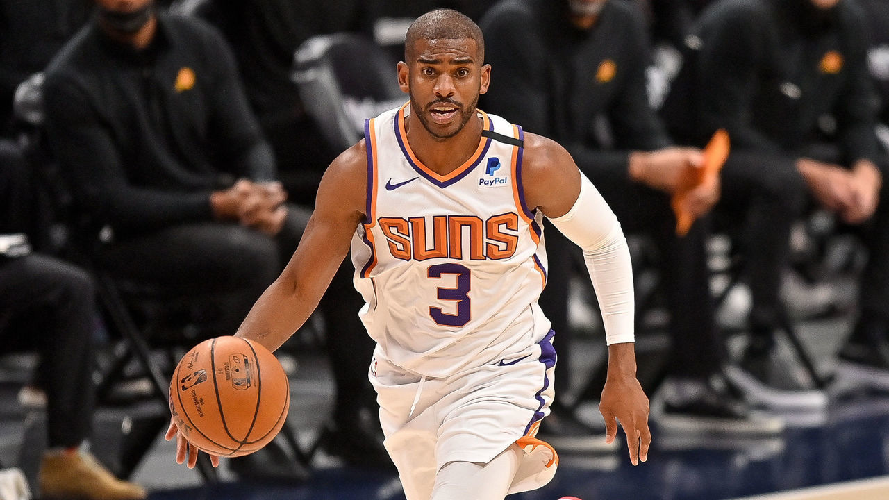DENVER, CO - JUNE 13: Chris Paul #3 of the Phoenix Suns dribbles against the Denver Nuggets in Game Four of the Western Conference second-round playoff series at Ball Arena on June 13, 2021 in Denver, Colorado.
