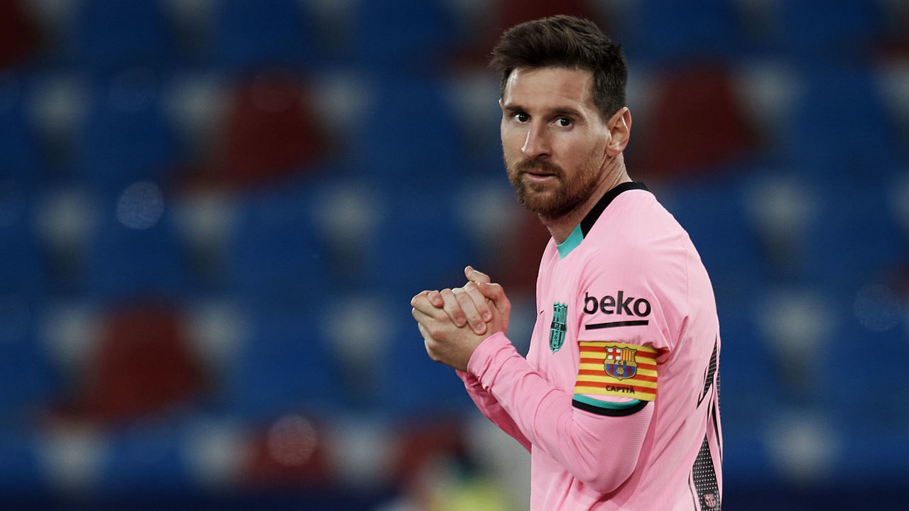 Lionel Messi of Barcelona reacts during the La Liga Santander match between Levante UD and FC Barcelona at Ciutat de Valencia Stadium on May 11, 2021 in Valencia, Spain. Sporting stadiums around Spain remain under strict restrictions due to the Coronavirus Pandemic as Government social distancing laws prohibit fans inside venues resulting in games being played behind closed doors.