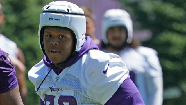 EAGAN, MN - JUNE 16: Minnesota Vikings guard Kyle Hinton (68) and Minnesota Vikings defensive tackle Jaylen Twyman (76) follow the play during Vikings Minicamp on June 16, 2021 at Twin Cities Orthopedics Performance Center in Eagan, Minnesota.