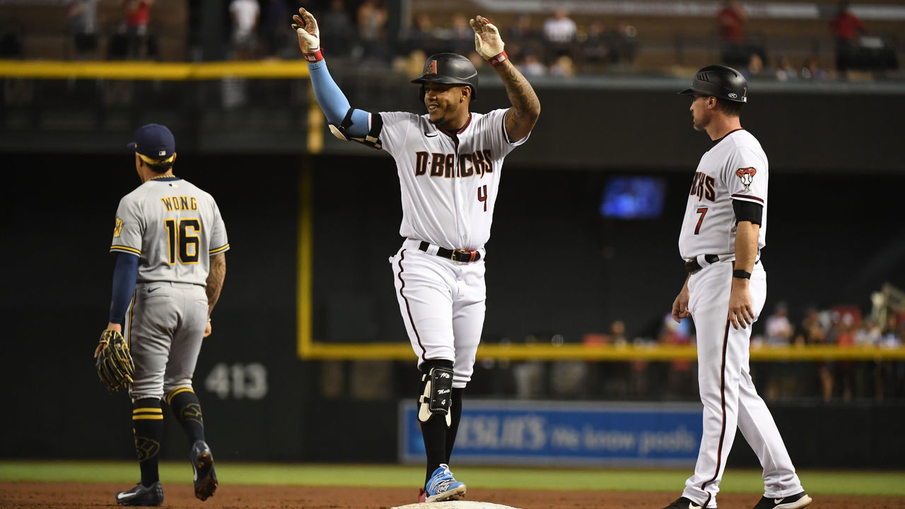 PHOENIX, ARIZONA - JUNE 21: Ketel Marte #4 of the Arizona Diamondbacks celebrates after hitting an RBI single against the Milwaukee Brewers during the second inning at Chase Field on June 21, 2021 in Phoenix, Arizona.