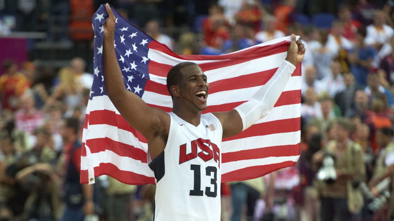 Basketball: 2012 Summer Olympics: USA Chris Paul (13) victorious with flag after winning Men's Gold Medal Game vs Spain at North Greenwich Arena. London, United Kingdom 8/12/2012 CREDIT: John Biever (Set Number: X155185 TK2 R1 F64 )