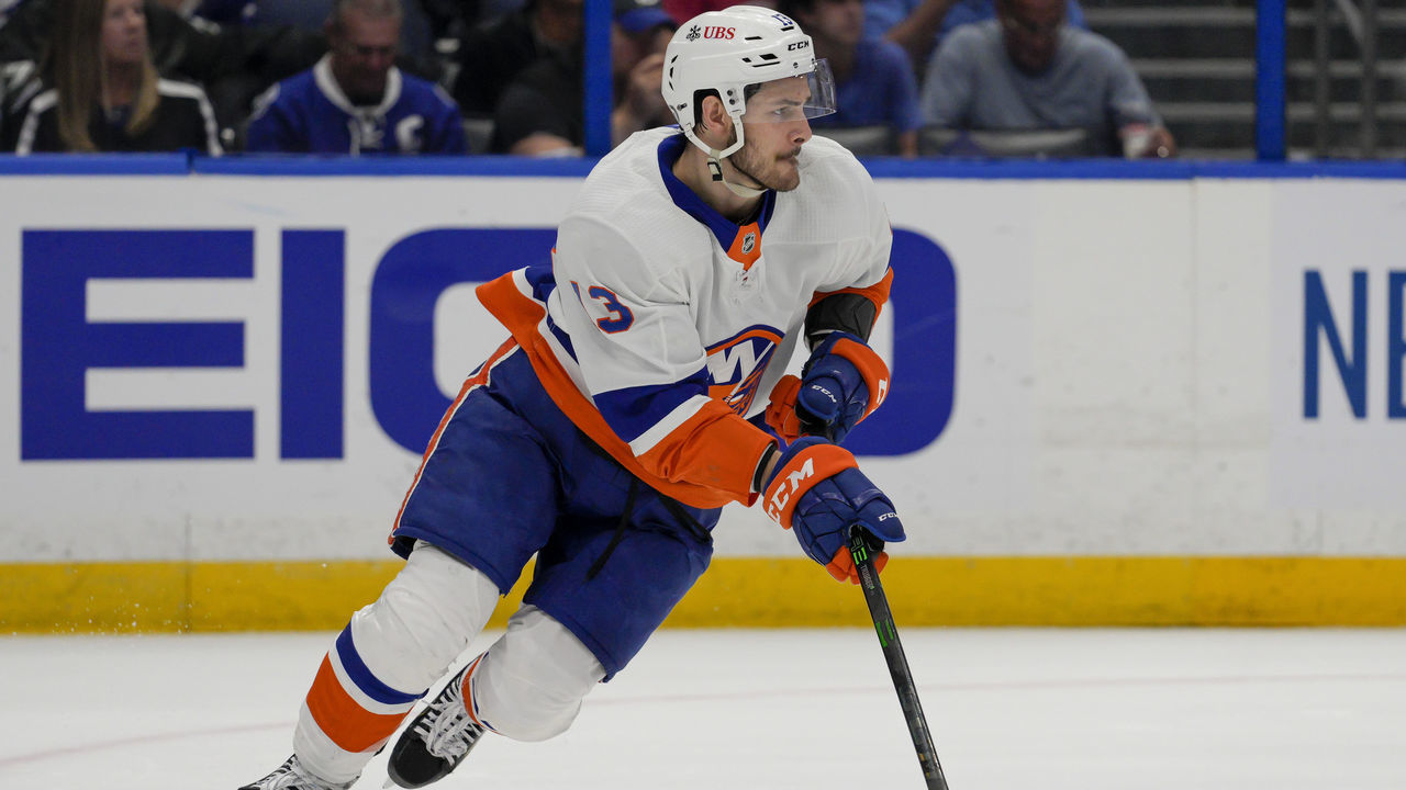 TAMPA, FL - JUNE 21: New York Islanders center Mathew Barzal (13) looks to clear the puck during game 5 of NHL Stanley Cup 3rd round Hockey match between the Tampa Bay Lightning and New York Islanders on June 21, 2021 at Amalie Arena in Tampa, FL.