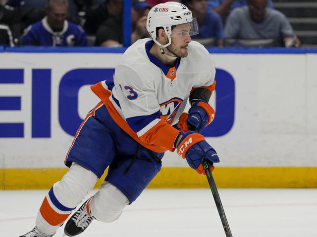 TAMPA, FL - JUNE 21: New York Islanders center Mathew Barzal (13) looks to clear the puck during game 5 of NHL Stanley Cup 3rd round Hockey match between the Tampa Bay Lightning and New York Islanders on June 21, 2021 at Amalie Arena in Tampa, FL.