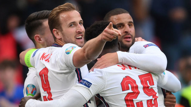 TOPSHOT - England's forward Raheem Sterling (hidden) celebrates scoring the opening goal with his teammates including England's forward Harry Kane, England's midfielder Bukayo Saka and England's defender Kyle Walker during the UEFA EURO 2020 Group D football match between Czech Republic and England at Wembley Stadium in London on June 22, 2021.