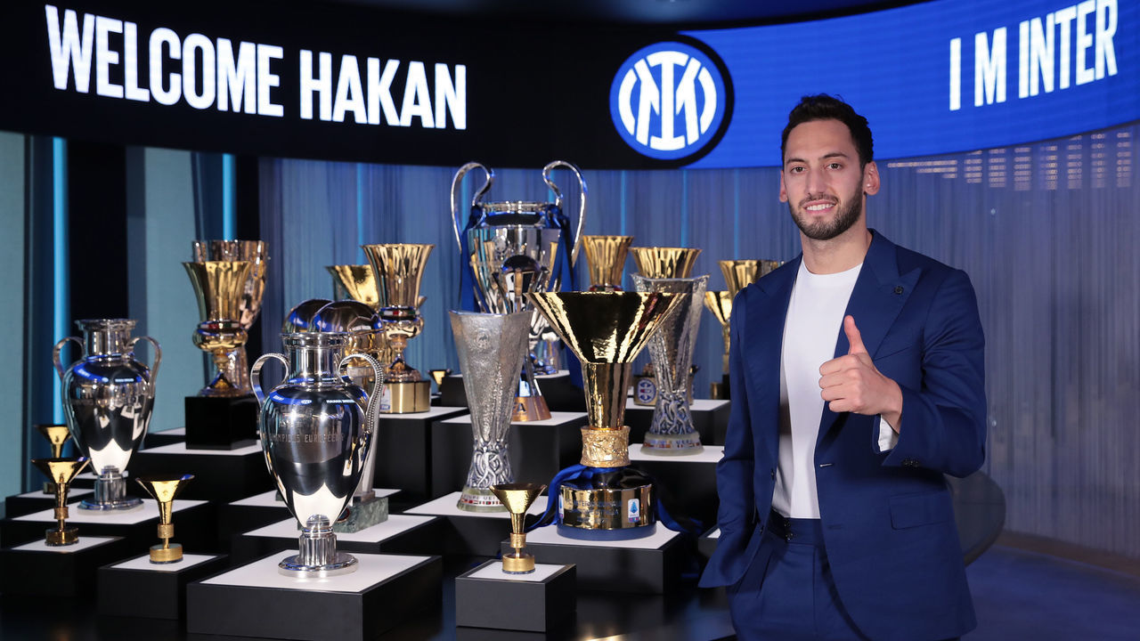 MILAN, ITALY - JUNE 22: FC Internazionale new signing Hakan Calhanoglu poses at FC Internazionale headquarters on June 22, 2021 in Milan, Italy.