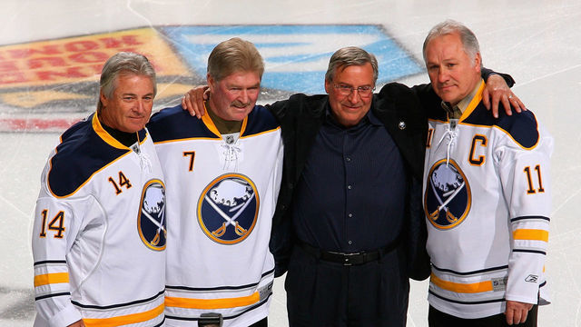 BUFFALO, NY - FEBRUARY 23: New Buffalo Sabres owner Terry Pegula stands with former Sabres palyers Rene Robert #14, Rick Martin #7 and Gilbert Perreault #11 during pre game ceremonies prior to play against the Atlanta Thrashers at HSBC Arena on February 23, 2011 in Buffalo, New York.