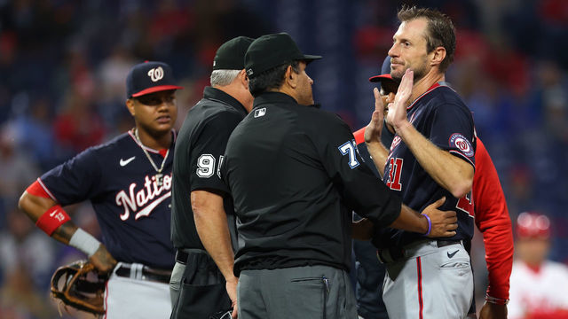 PHILADELPHIA, PA - JUNE 22: Pitcher Max Scherzer #31 of the Washington Nationals is searched for foreign substances by umpires Tim Timmons #95 and Alfonso Marquez #72 during the fourth inning of a game against the Philadelphia Phillies at Citizens Bank Park on June 22, 2021 in Philadelphia, Pennsylvania.