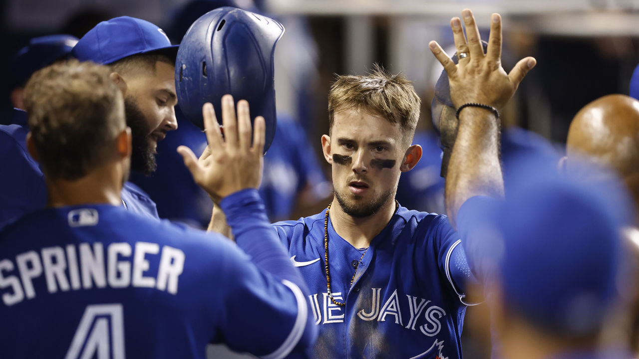 MIAMI, FLORIDA - JUNE 22: Cavan Biggio #8 of the Toronto Blue Jays celebrates with teammates after scoring a run during the ninth inning on a RBI double by Lourdes Gurriel Jr. #13 (not pictured) against the Miami Marlins at loanDepot park on June 22, 2021 in Miami, Florida.