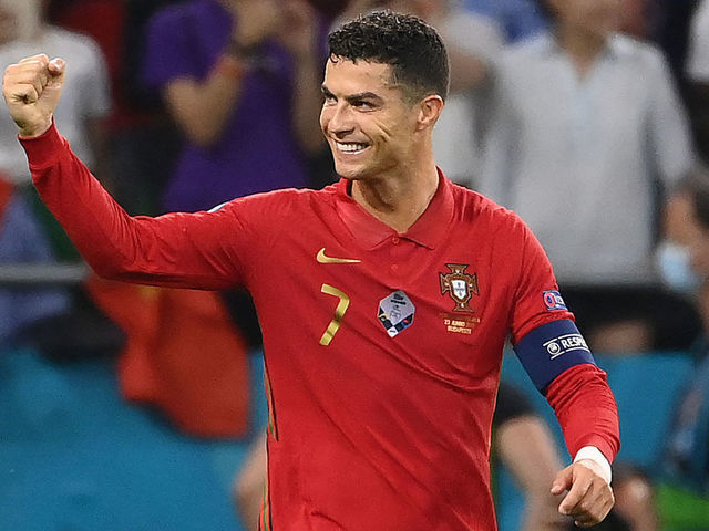 Portugal's forward Cristiano Ronaldo celebrates after scoring a penalty kick during the UEFA EURO 2020 Group F football match between Portugal and France at Puskas Arena in Budapest on June 23, 2021.