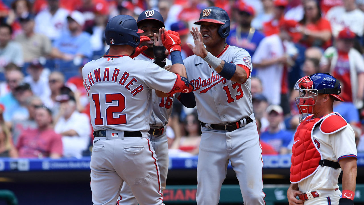 PHILADELPHIA, PA - JUNE 23: Washington Nationals left fielder Kyle Schwarber (12) celebrates a three-run home run with center fielder Victor Robles (16) and third baseman Starlin Castro (13) in the fifth inning during the game between the Washington Nationals and Philadelphia Phillies on June 23, 2021 at Citizens Bank Park in Philadelphia, PA.