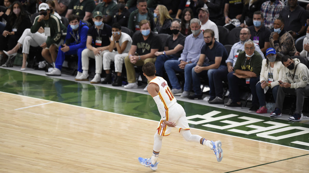 MILWAUKEE, WISCONSIN - JUNE 23: Trae Young #11 of the Atlanta Hawks celebrates a basket against the Milwaukee Bucks during the second quarter in game one of the Eastern Conference Finals at Fiserv Forum on June 23, 2021 in Milwaukee, Wisconsin.