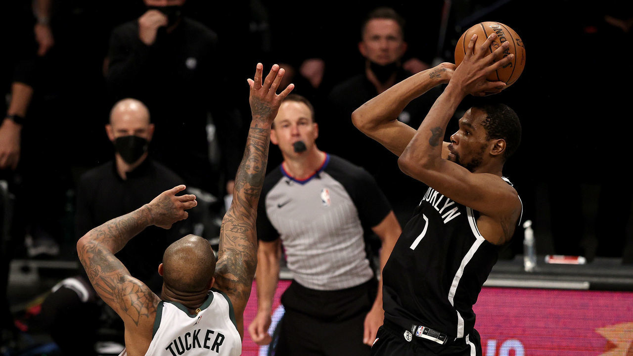 NEW YORK, NEW YORK - JUNE 19: Kevin Durant #7 of the Brooklyn Nets takes a shot to tie the game and force overtime as P.J. Tucker #17 of the Milwaukee Bucks defends in the final seconds of regulation during game seven of the Eastern Conference second round at Barclays Center on June 19, 2021 in the Brooklyn borough of New York City.