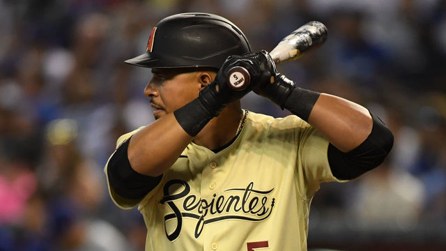 PHOENIX, ARIZONA - JUNE 18: Eduardo Escobar #5 of the Arizona Diamondbacks gets ready in the batters box against the Los Angeles Dodgers at Chase Field on June 18, 2021 in Phoenix, Arizona.