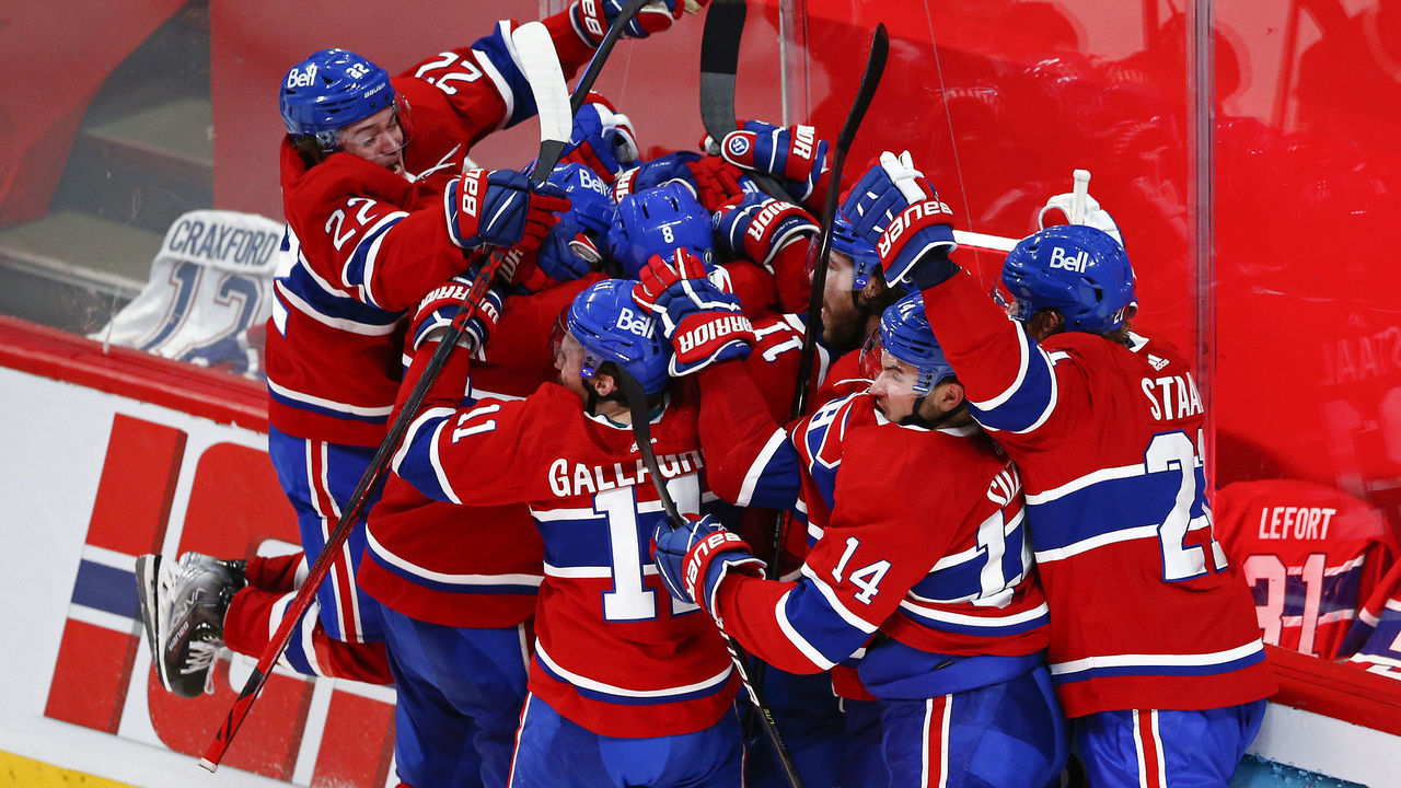 MONTREAL, QUEBEC - JUNE 24: Artturi Lehkonen #62 of the Montreal Canadiens is congratulated by his teammates after scoring the game-winning goal during the first overtime period against the Vegas Golden Knights in Game Six of the Stanley Cup Semifinals of the 2021 Stanley Cup Playoffs at Bell Centre on June 24, 2021 in Montreal, Quebec.