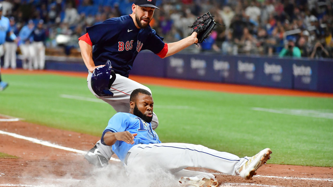 ST PETERSBURG, FLORIDA - JUNE 24: Manuel Margot #13 of the Tampa Bay Rays slides home in the ninth inning after Matt Barnes #32 of the Boston Red Sox threw a wild pitch at Tropicana Field on June 24, 2021 in St Petersburg, Florida. The Rays defeated the Red Sox 1-0.