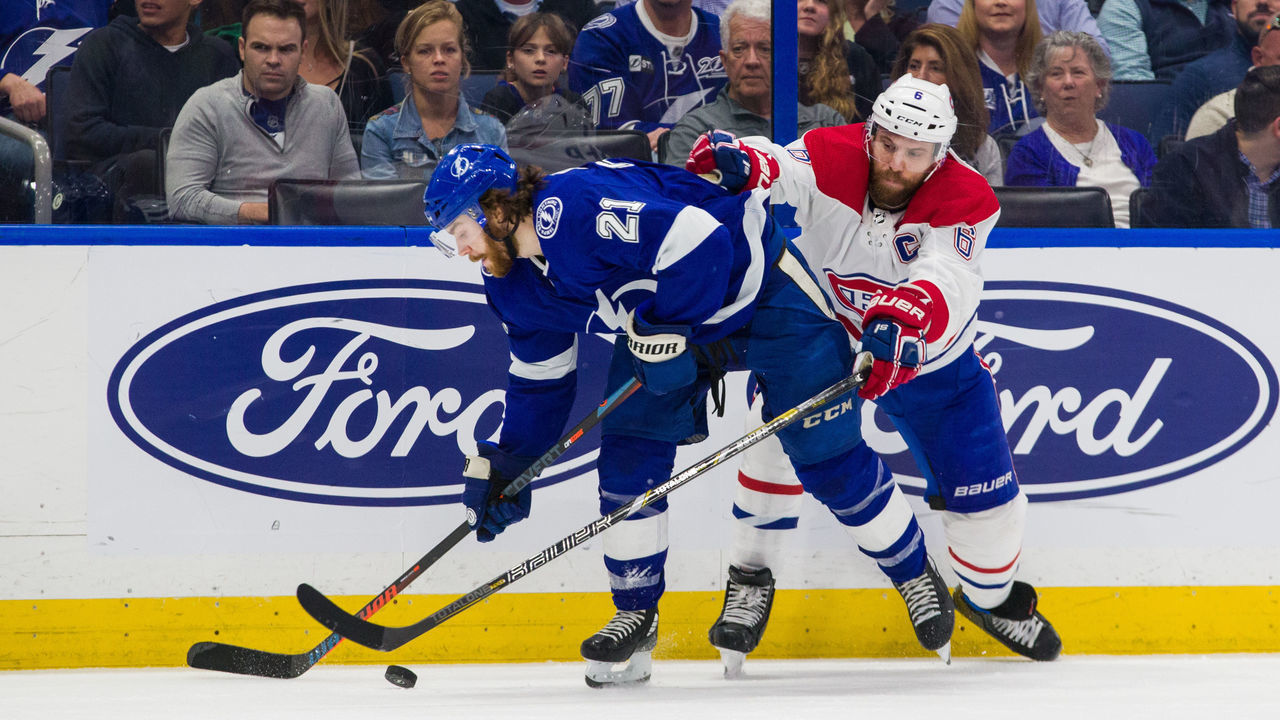 TAMPA, FL - MARCH 5: Brayden Point #21 of the Tampa Bay Lightning skates against Shea Weber #6 of the Montreal Canadiens during the second period at Amalie Arena on March 5, 2020 in Tampa, Florida.