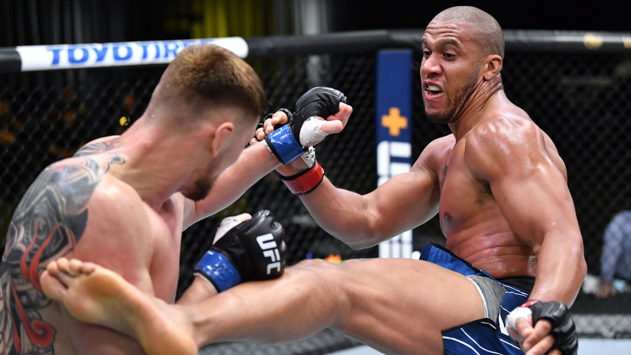 LAS VEGAS, NEVADA - JUNE 26: (R-L) Ciryl Gane of France kicks Alexander Volkov of Russia in a heavyweight fight during the UFC Fight Night event at UFC APEX on June 26, 2021 in Las Vegas, Nevada.