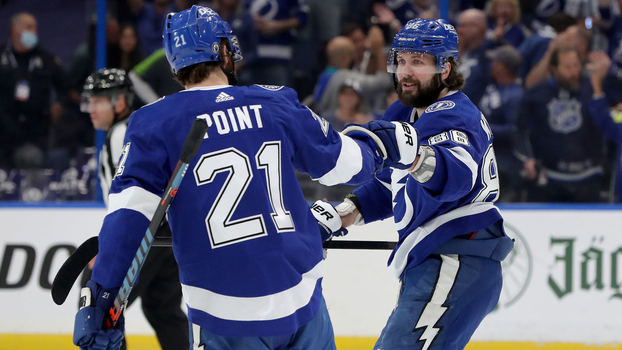 TAMPA, FLORIDA - JUNE 15: Brayden Point #21 of the Tampa Bay Lightning celebrates with Nikita Kucherov #86 after scoring a goal on Semyon Varlamov #40 of the New York Islanders during the first period in Game Two of the Stanley Cup Semifinals in the 2021 Stanley Cup Playoffs at Amalie Arena on June 15, 2021 in Tampa, Florida.